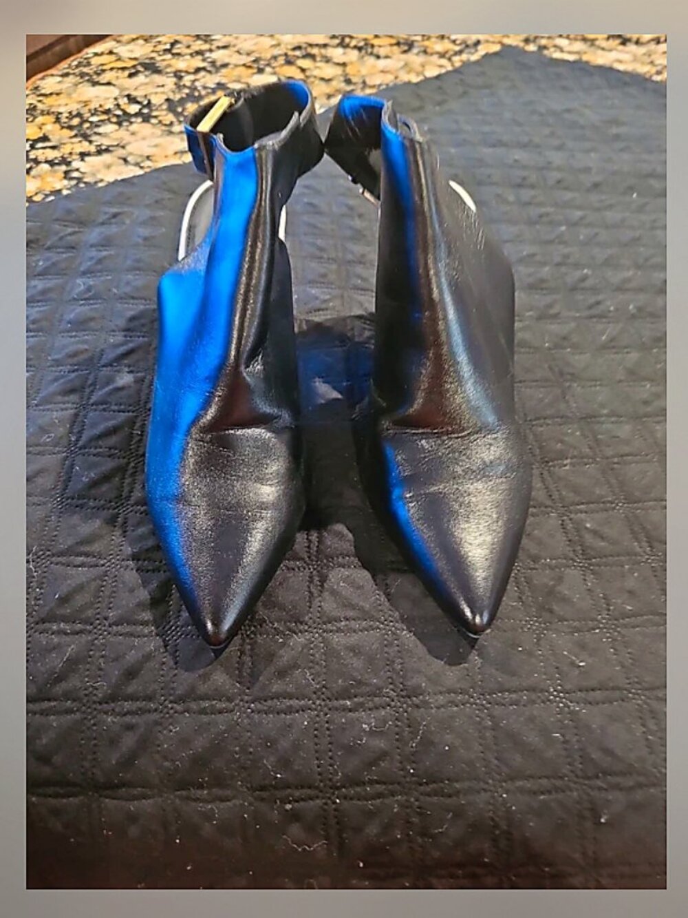 Black shoes with snake heels